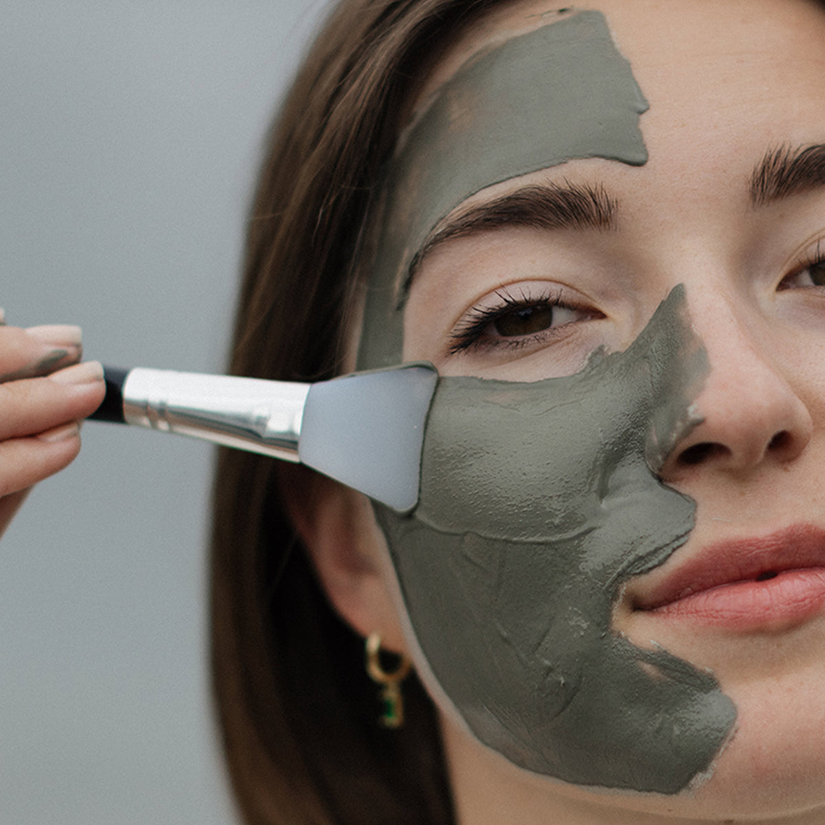 Woman applying NENA Glacial Clay Mask | Made of 98% Glacial Oceanic Clay - Natural Skincare